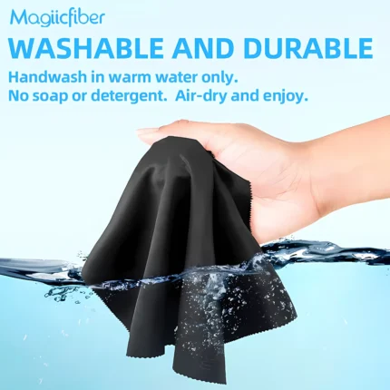 A premium set of dark grey and white MagicFiber Microfiber Cleaning Cloths neatly arranged showing the soft textured fabric and heat-sealed saw-tooth edges.
