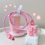 Charger data cable protector set with decorative bow adapters and spiral cord wrap.